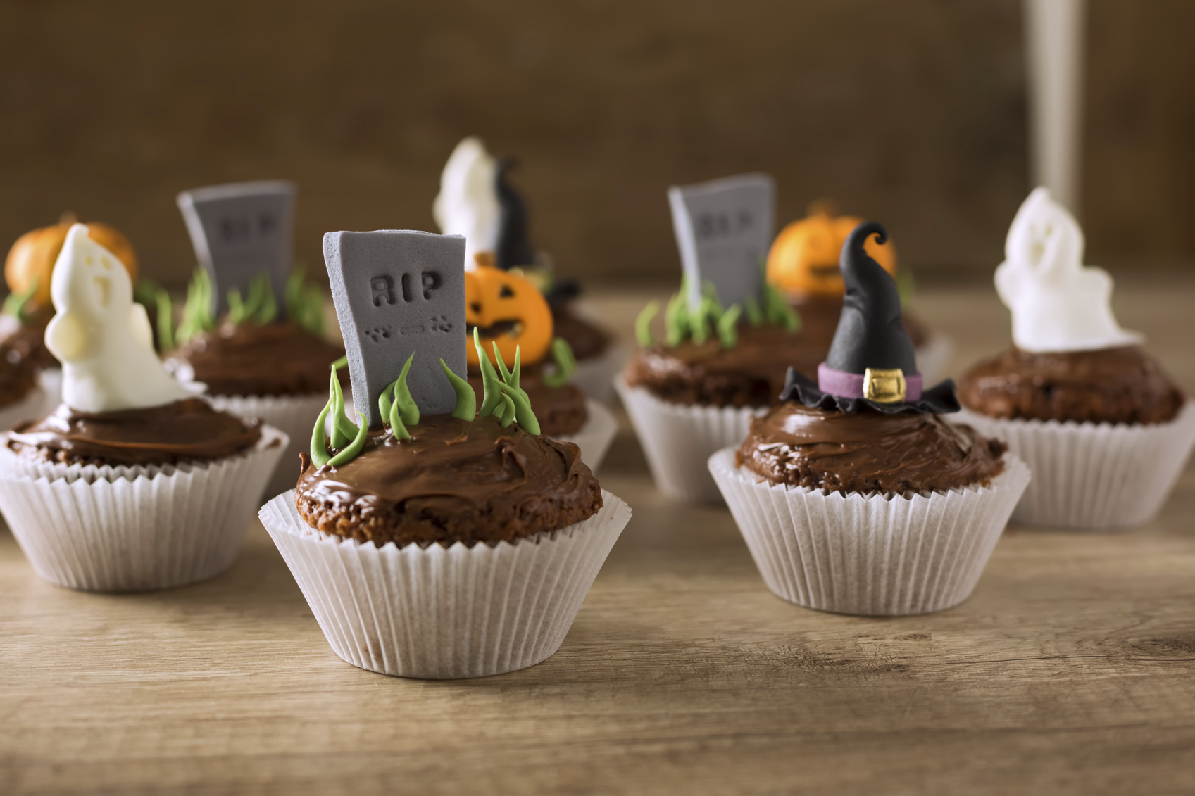 Group of helloween cupcakes on wood table