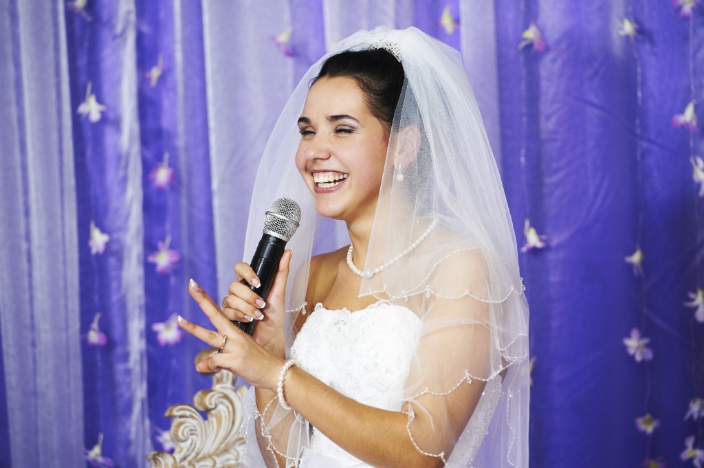 Joyful bride speaks at banquet