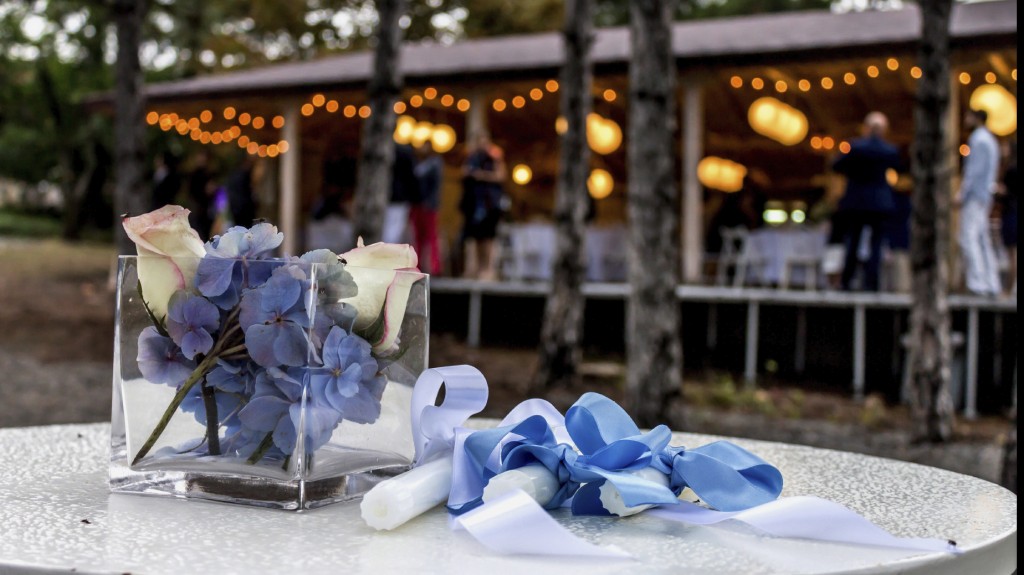 Closeup of flowers and candles for the newlyweds